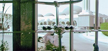 The view of the Grand Mosque from inside Darwish Travel in the mid-1960s – image developed from a YouTube video