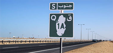 A sign for a main road in Qatar