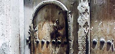 A door photographed in the centre of Doha, 1966 – image developed from a YouTube video