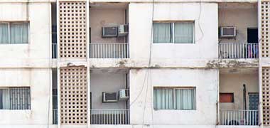 Three air conditioning units on each balcony, and at the wrong height
