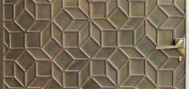 Patterning on a door in the suq in Abu Dhabi, with the permission of Mirek Majewscy