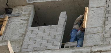 A worker operating above grade