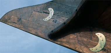 A brass crescent let into the prow of a dhow