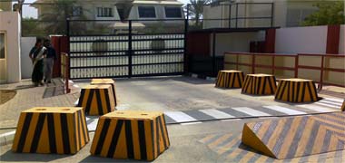 Pre-cast concrete barriers and a vehicle barrier