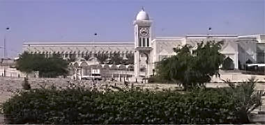 The clock tower in front of the old Diwan Al Amiri