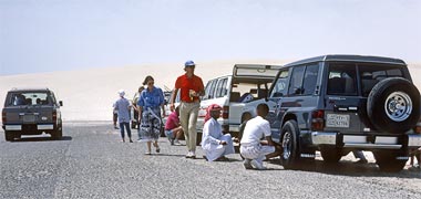 A group of expatriates and Qataris preparing to move into the sand dunes south of Umm Said, 1988