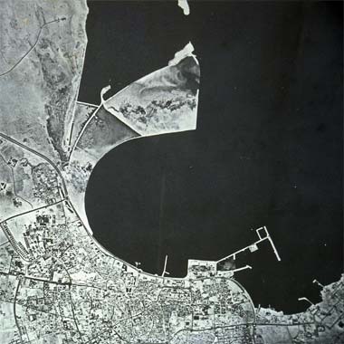 An aerial view of the West Bay with the bund under construction