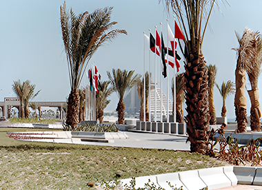 Flags on the Corniche with a celebratory arch on the left
