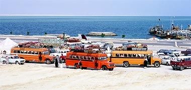 Buses waiting on feriq al-Salata, 1973, to take pilgrims on the hajj