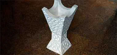 A carved plaster incense burner