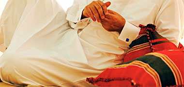 Leaning on a misnad in the desert – with permission from Qatar&Me on Flickr Leaning on a misnad in the desert