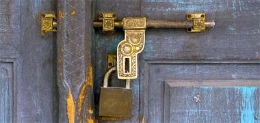 A brass bolt and lock on a traditional door – with permission from Heidi Donat on Flickr