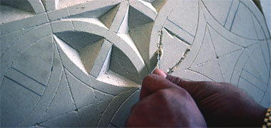 Detail of a pattern being carved into a panel