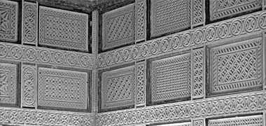 Part of a wall of carving with duplication of panels vertically