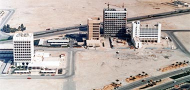 An aerial view of the Candilis intermediate staff housing project, seen over the first office buildings in the New District of Doha