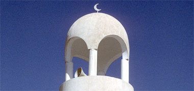 The top of the minaret of a simply designed mosque