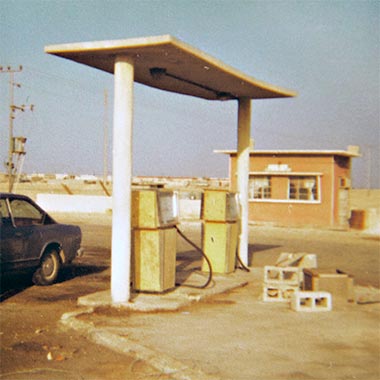 A 1970s Polaroid photograph of early petrol station pumps