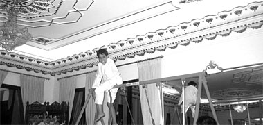 A boy playing inside a house