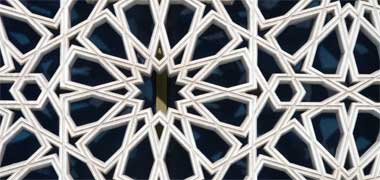 Detail of a pre-cast concrete naqsh panel on a commercial building