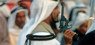 A dancer carrying an old revolver