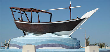 A dhow sculpture on a roundabout at Ruweis