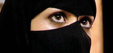 A Saudi young woman wearing a batula