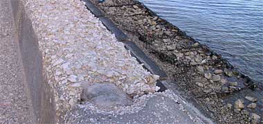 The pre-cast seating unit on the Corniche, damaged by sea water action