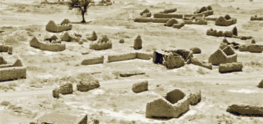 An aerial view in the Emirates of a number of pitched roofed dwellings