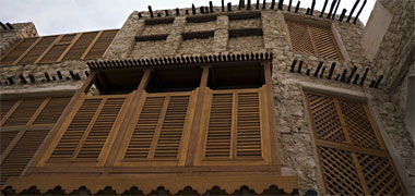 New shutters on a reconstructed building in Suq Waqf