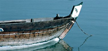 The prow of a small craft painted with the crescent and star motif