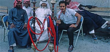 Customers enjoying their water pipes in the suq – April 1972
