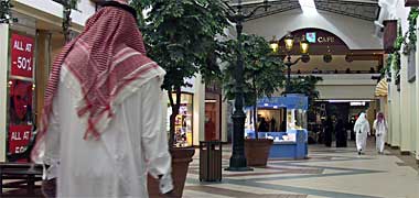 Men walking in a shopping centre
