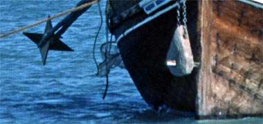 A pearling boat carrying two anchors