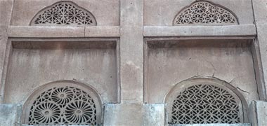 Carved naqsh ventilation panels in an old Wakra building