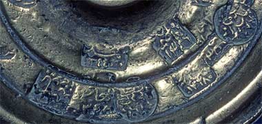 Detail from an old brass weight with Municipality proof marks