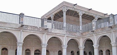 Wooden screens at first floor level on an old building