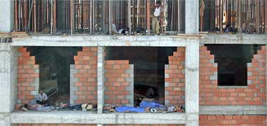 Workers resting on a building under construction