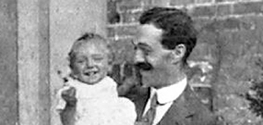 Andrew holding his son, my father, 1913