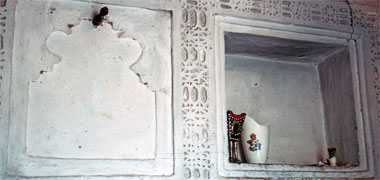 A decorative recessed panel and shelf