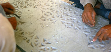 Plasterwork being carved