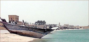 A line of fishing boats drawn up along the beach at Wakra