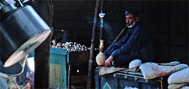 An earthenware water pipe being smoked in the suq – November 1972