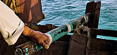 The traditional way of steering a small boat