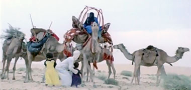 A family being lifted onto a hawdaj in preparation for travel – the image developed from an AlrayyanTV video