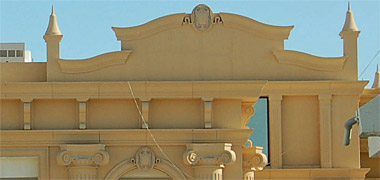 An entablature and pediment detail from a classically styled building under construction