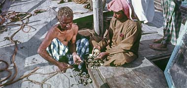 Oysters being opened on deck – from an official Qatar government photo from the early 1970s