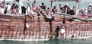 A pearl diver jumping into the sea – an official Qatar government photo from the early 1970s