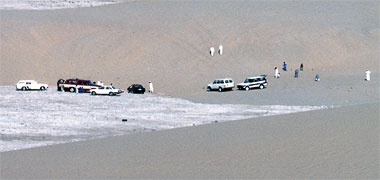 A group of families enjoying the sand dunes