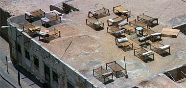 A number of beds on a roof in the central area of Doha