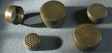 A selection of brass pearl sieves